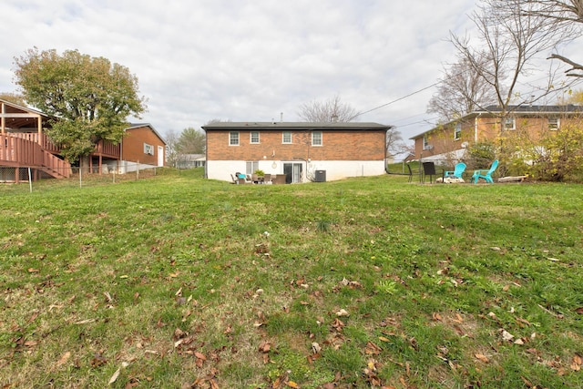 rear view of house with a lawn