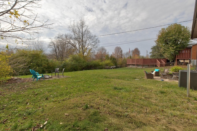 view of yard featuring a fire pit and a patio