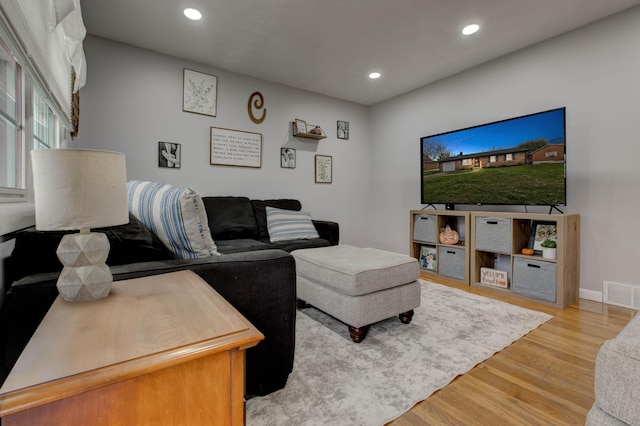 living room with light hardwood / wood-style floors