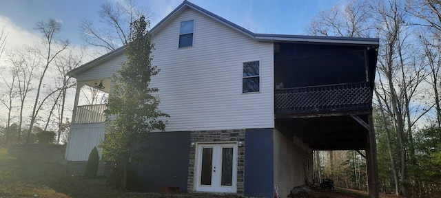 view of side of property featuring french doors