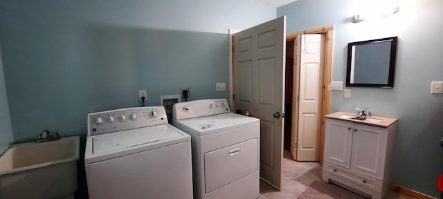 laundry room featuring washer and clothes dryer and sink