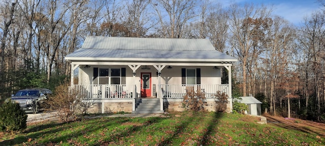 bungalow-style home with a porch and a front yard