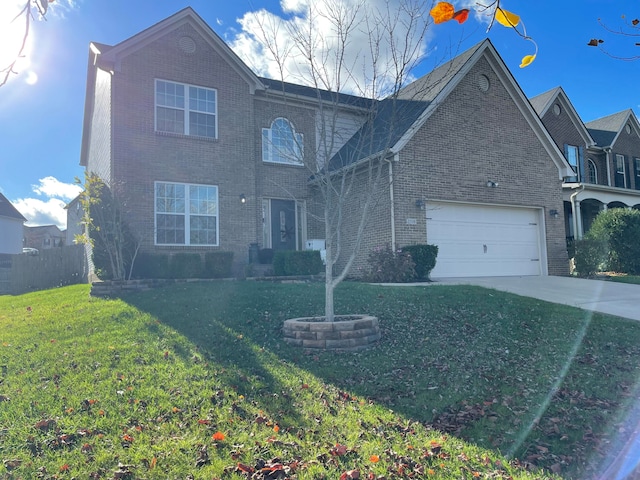 view of property with a front yard and a garage