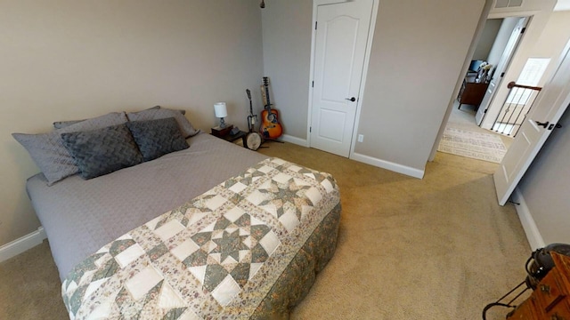 bedroom with light carpet