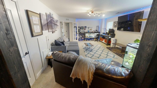 living room with light colored carpet and a wealth of natural light