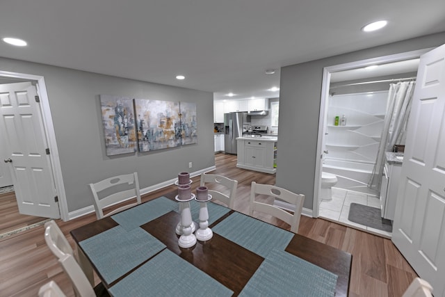 dining space with light wood-type flooring