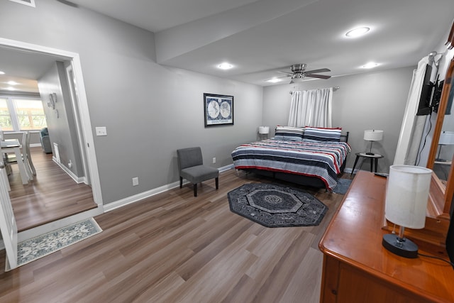 bedroom featuring wood-type flooring and ceiling fan