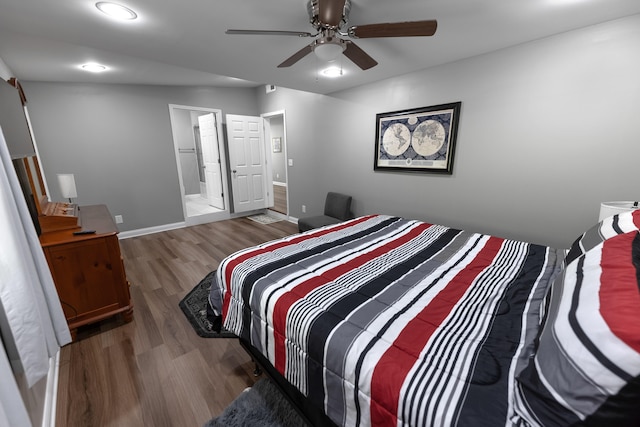 bedroom with ceiling fan, ensuite bathroom, and dark wood-type flooring