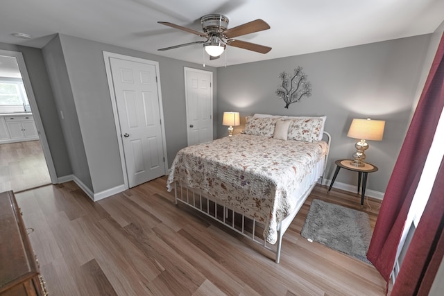 bedroom with ceiling fan and hardwood / wood-style flooring