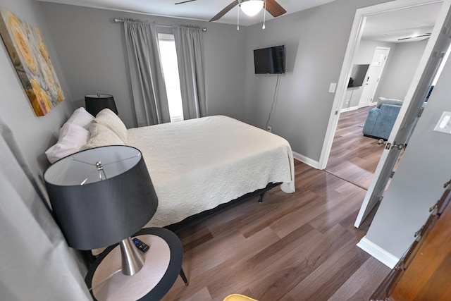 bedroom featuring ceiling fan and hardwood / wood-style floors