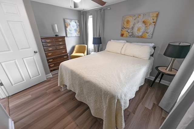 bedroom featuring ceiling fan and dark hardwood / wood-style flooring