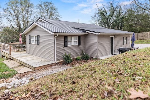 rear view of property with a deck