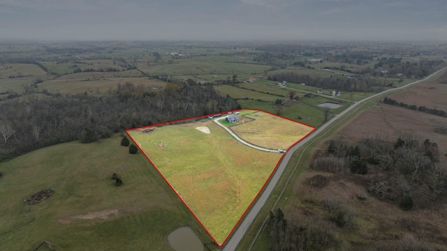 birds eye view of property with a rural view