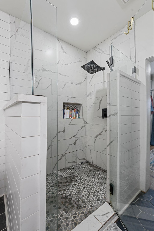 full bath featuring tiled shower