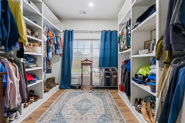 spacious closet with visible vents and wood finished floors