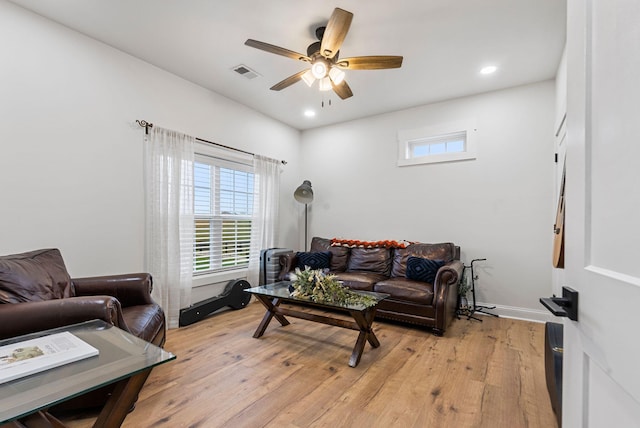 living area with ceiling fan, light wood finished floors, visible vents, and recessed lighting