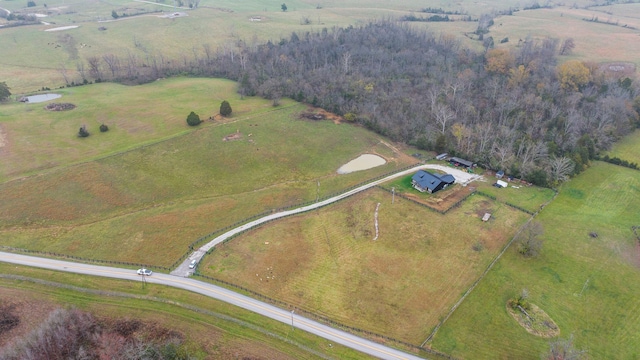 birds eye view of property with a rural view