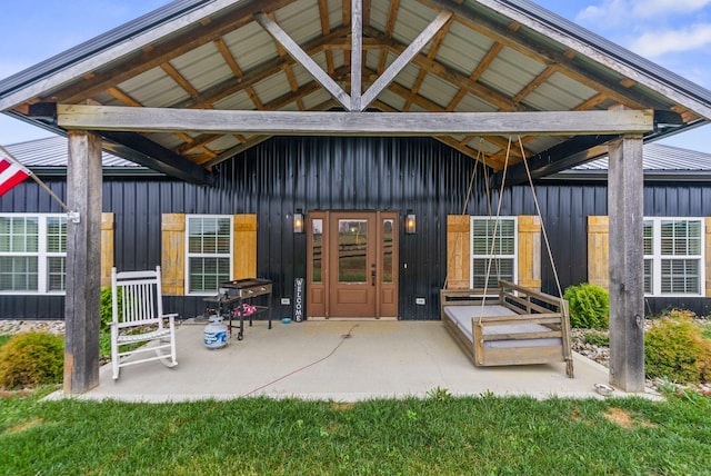 back of property featuring board and batten siding