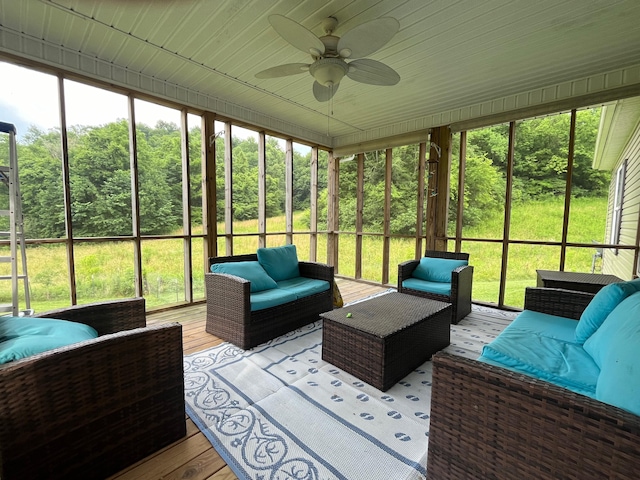 sunroom / solarium with ceiling fan