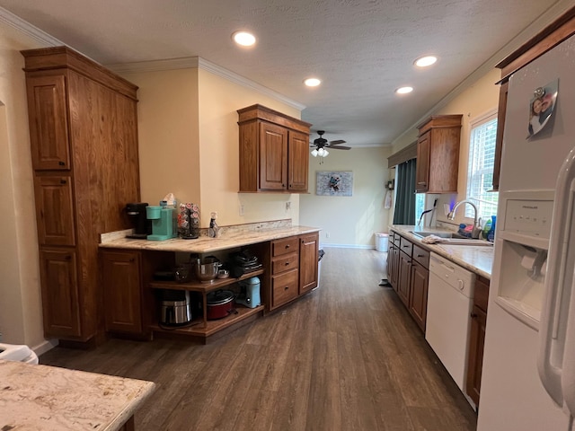 kitchen with white appliances, sink, ceiling fan, ornamental molding, and dark hardwood / wood-style flooring