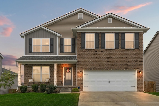 view of front of house with a lawn and a garage