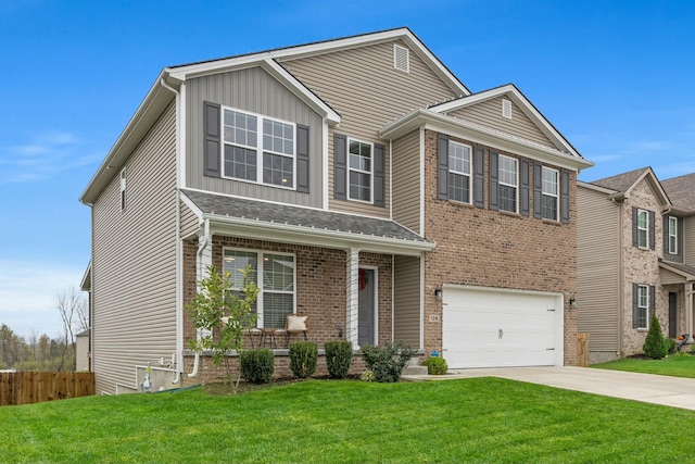 view of front of property with a garage and a front lawn