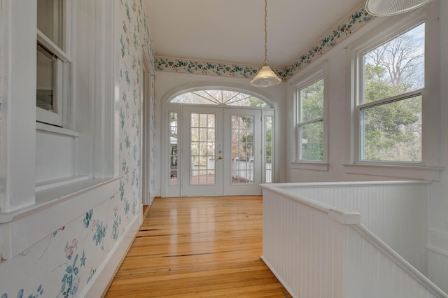 doorway featuring french doors and light wood-type flooring