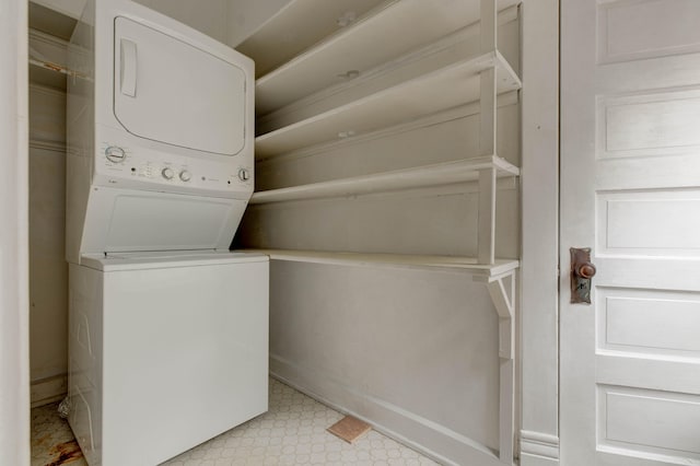 washroom featuring stacked washer and dryer