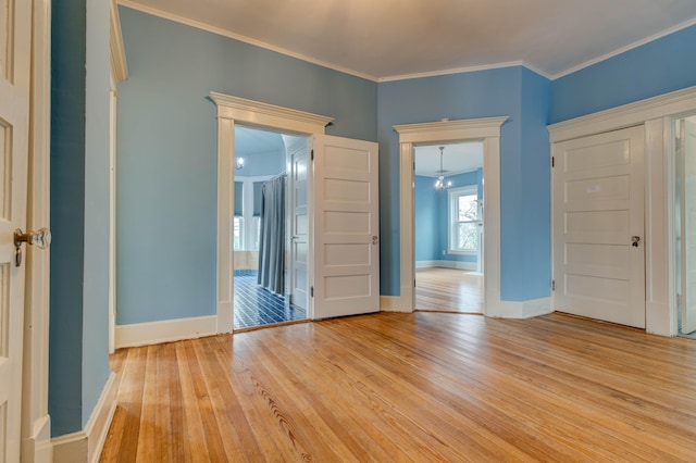 interior space with crown molding and light wood-type flooring