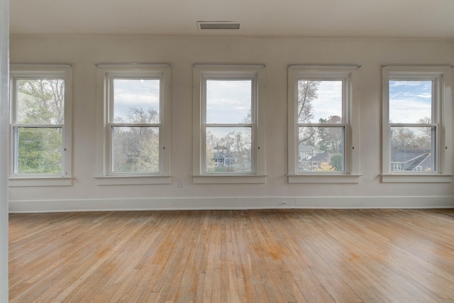 unfurnished sunroom featuring plenty of natural light