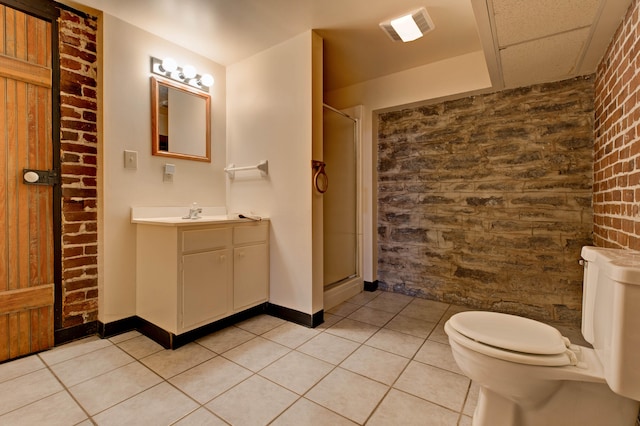 bathroom featuring tile patterned flooring, toilet, and walk in shower