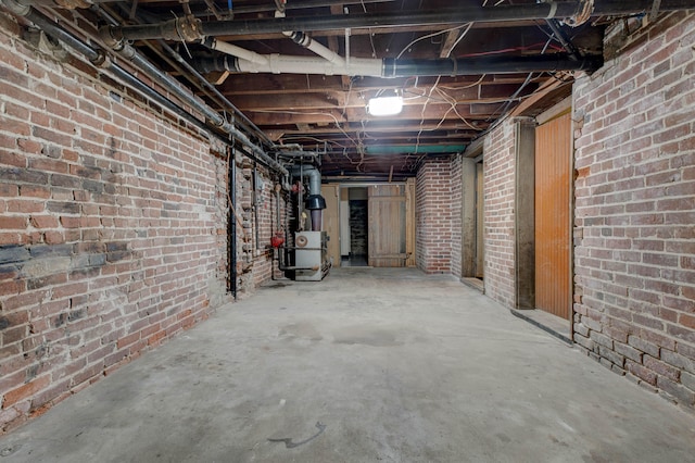 basement with brick wall