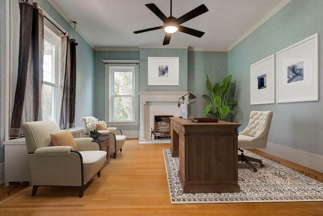 office space with ceiling fan, light hardwood / wood-style floors, and ornamental molding