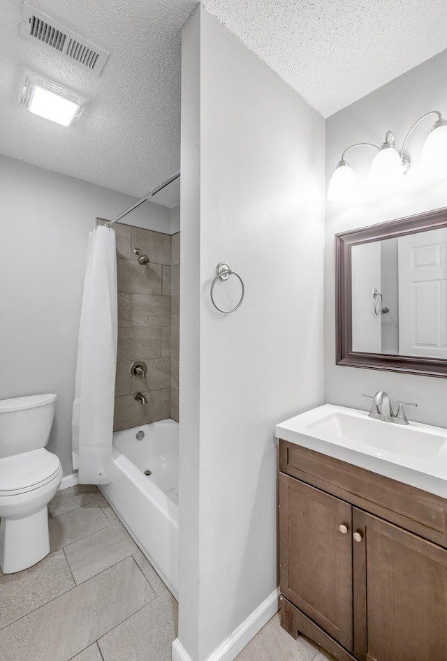 full bathroom featuring tile patterned flooring, vanity, a textured ceiling, toilet, and shower / bath combo with shower curtain