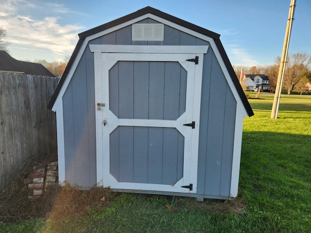 view of outdoor structure featuring a lawn