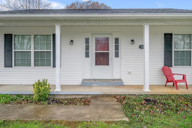 doorway to property featuring covered porch