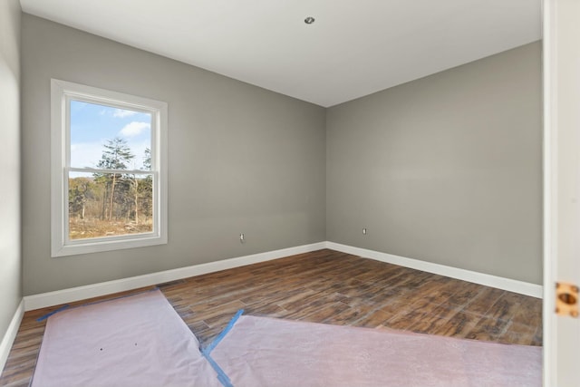 spare room featuring hardwood / wood-style floors