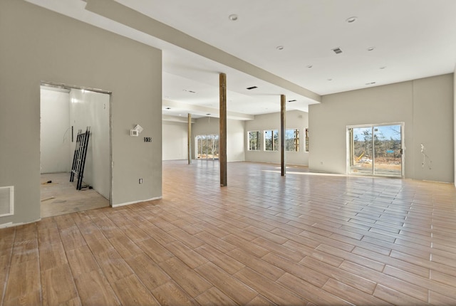 spare room with light hardwood / wood-style flooring