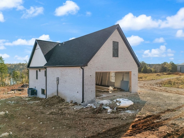 view of property exterior with central AC unit