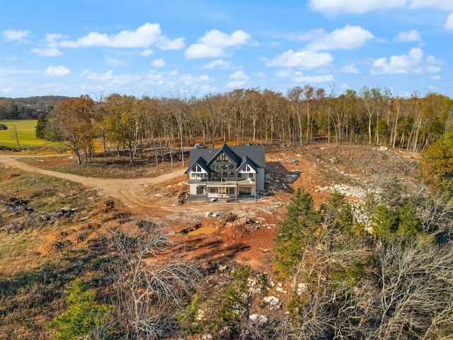 birds eye view of property with a rural view