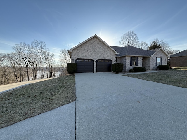 view of front facade featuring a garage and a front lawn