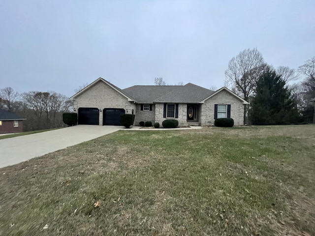 view of front of property with a garage and a front yard