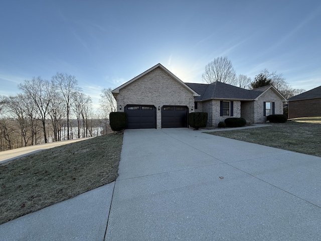 view of front of property with a garage and a front yard