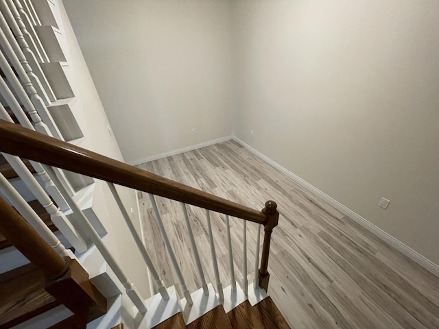 staircase featuring hardwood / wood-style floors