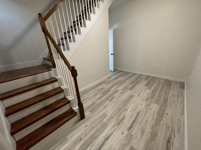 stairs with wood-type flooring