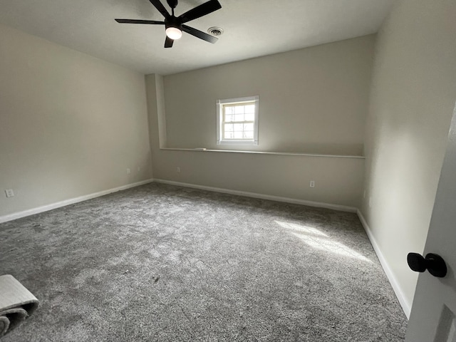 unfurnished room with ceiling fan and carpet flooring