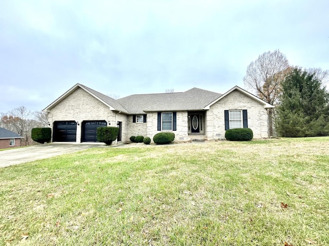 ranch-style home with a garage and a front lawn