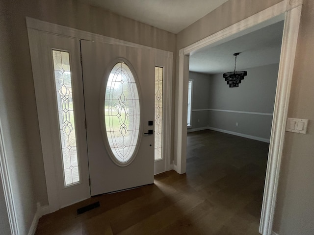 foyer with dark wood-type flooring