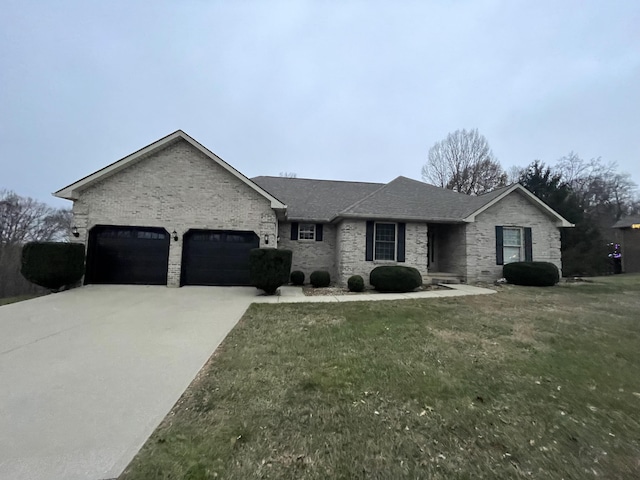 view of front of house with a garage and a front yard