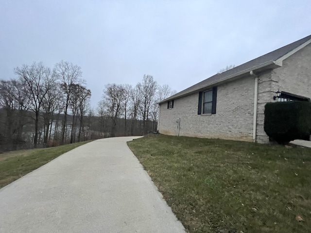 view of home's exterior featuring a yard